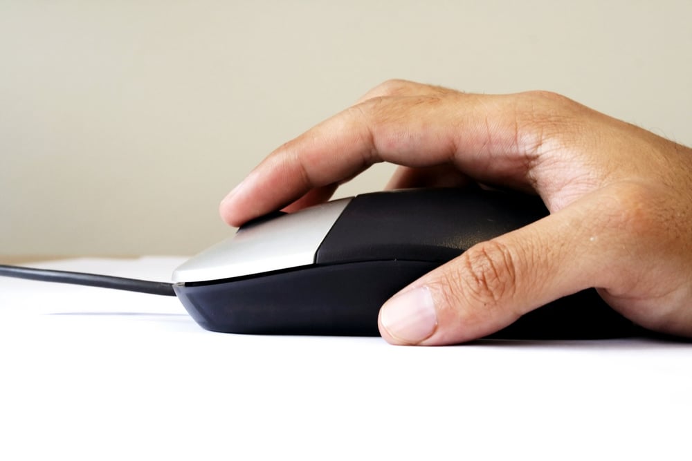 hand holding a mouse hand holding a mouse