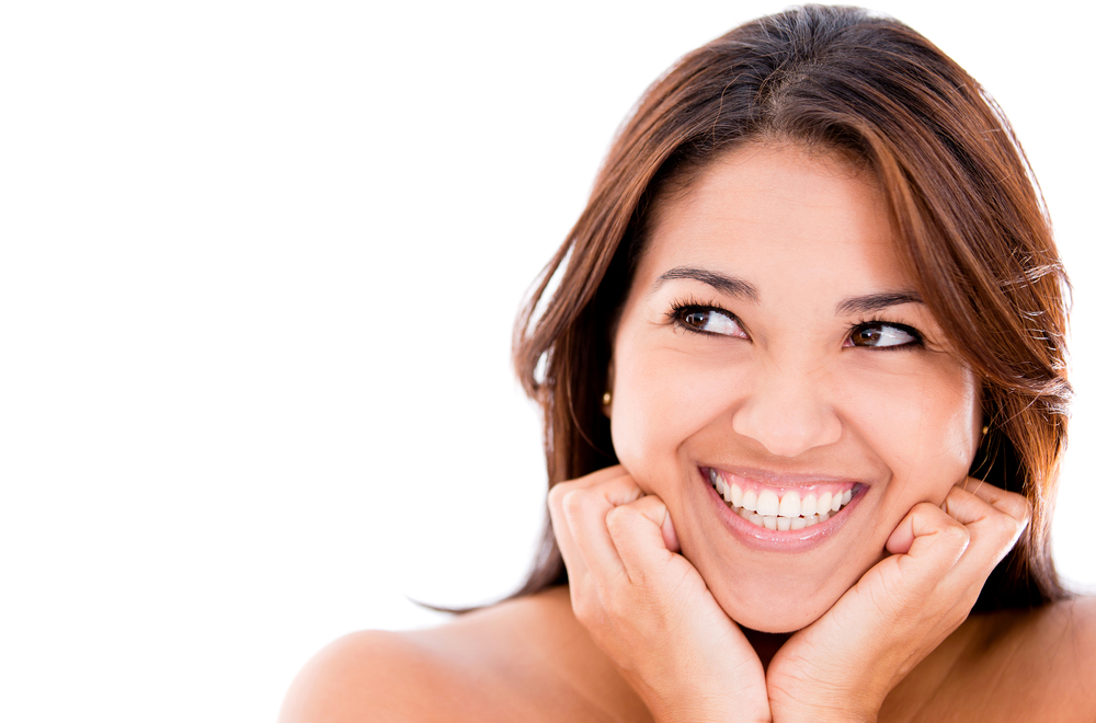 Happy thoughtful woman - isolated over a white background Happy thoughtful woman - isolated over a white background